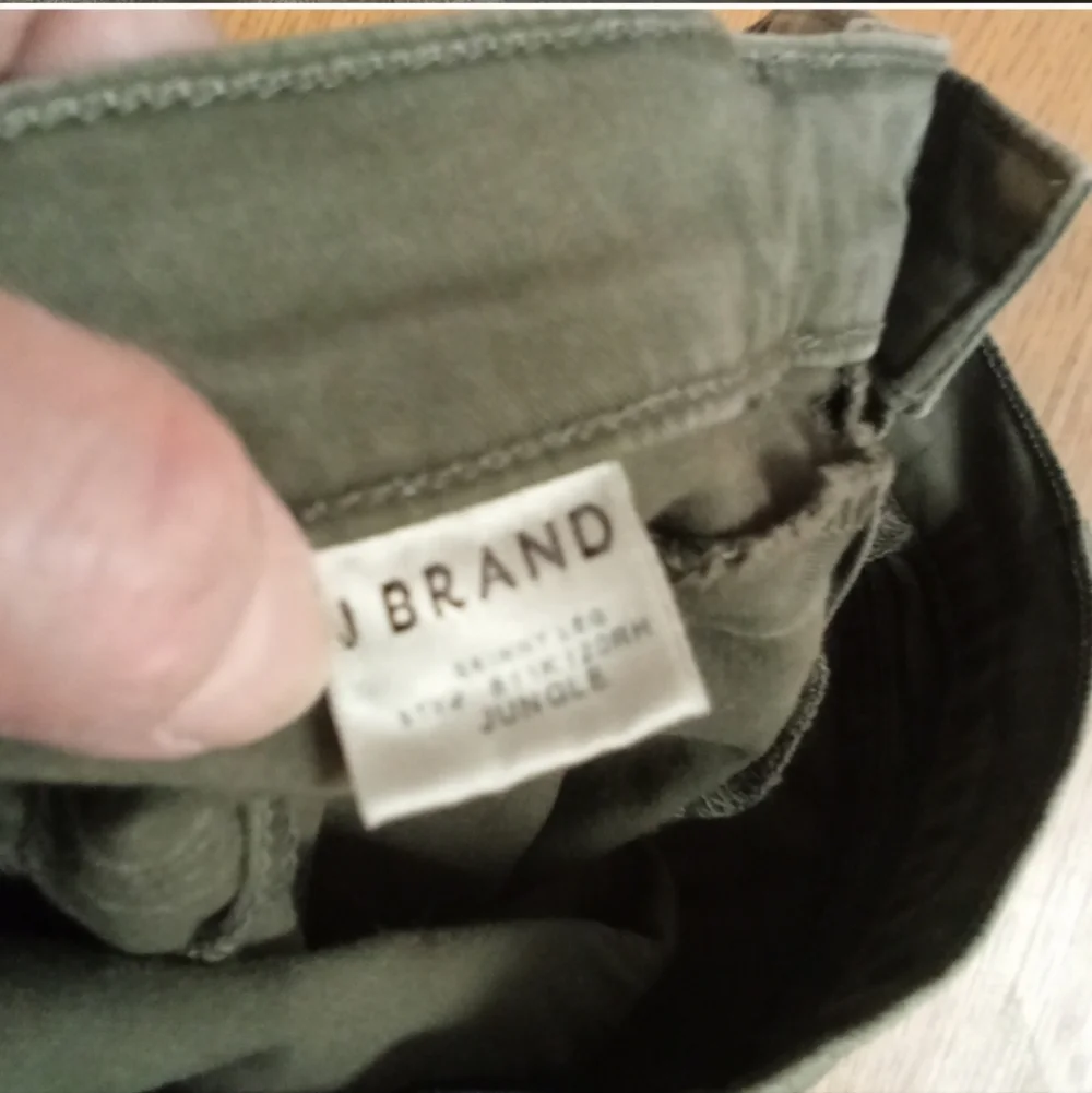 J brand olive green Jungle jeans distressed knees raw edge